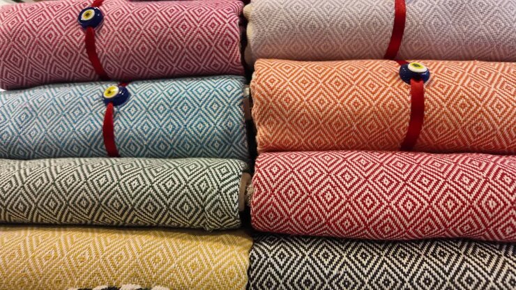 Colorful Stacked Turkish Towels with Evil Eye Charm