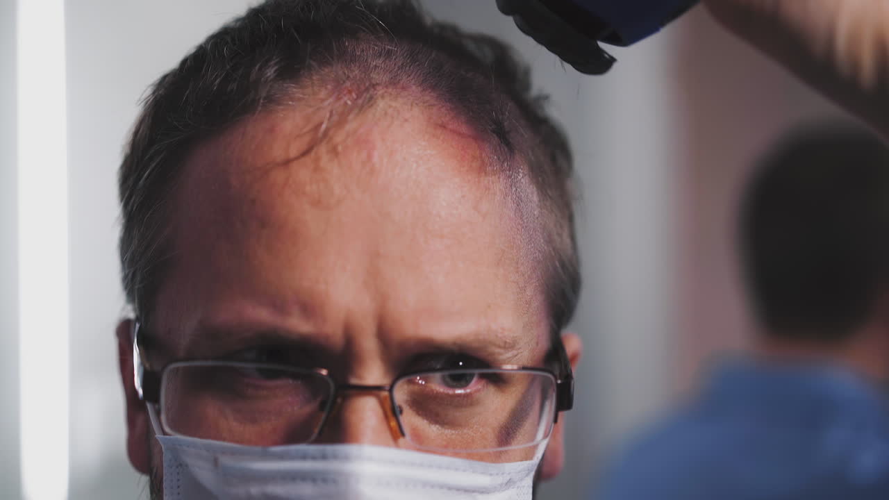 closeup of young shaggy unshaven doctor