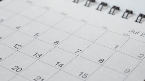 close-up of calendars showing july and may