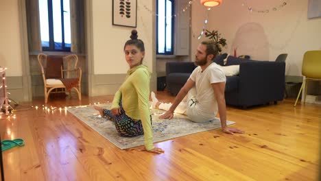 couple practicing yoga at home