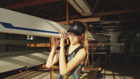 Female-rower-carrying-a-scull