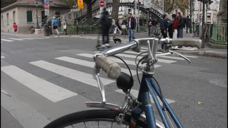 city street scene with pedestrians and bicycle