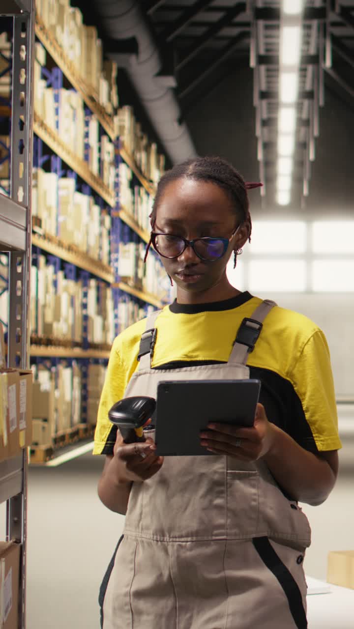 Vertical Video African american female worker using barcode scanner on shipping labels