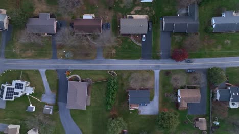 Dark-winter-top-down-drone-shot-of-American-neighborhood-at-dusk