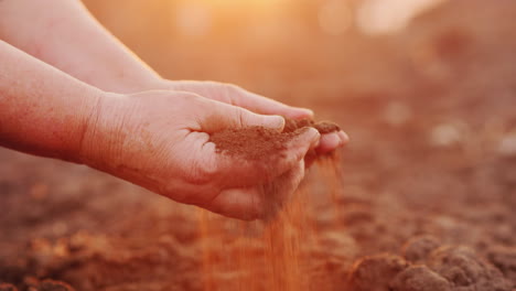 Farmer-Hands-With-Black-Soil-Organic-Farming-Concept