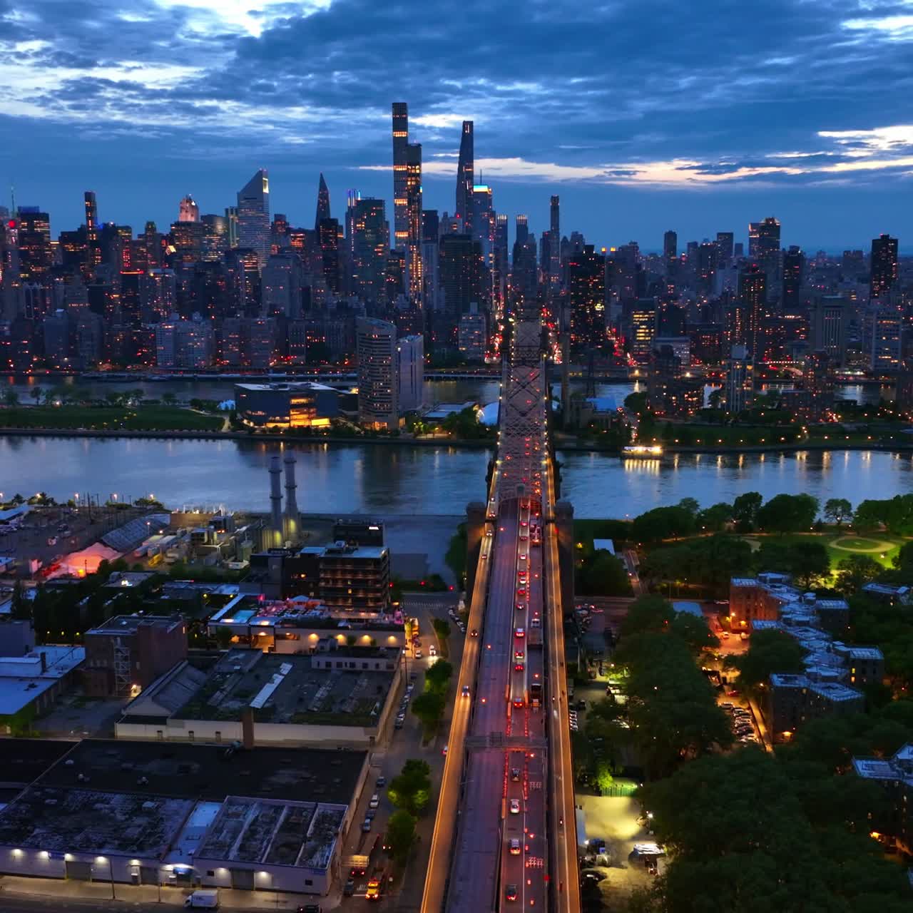 Picturesque scenery of evening New York. The 59th Street Bridge with lively traffic. Aerial view