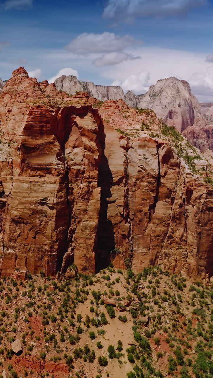 Bare lifeless mountains in the rays of hot sun. Amazing canyons of Utah State from aerial drone footage. Vertical video