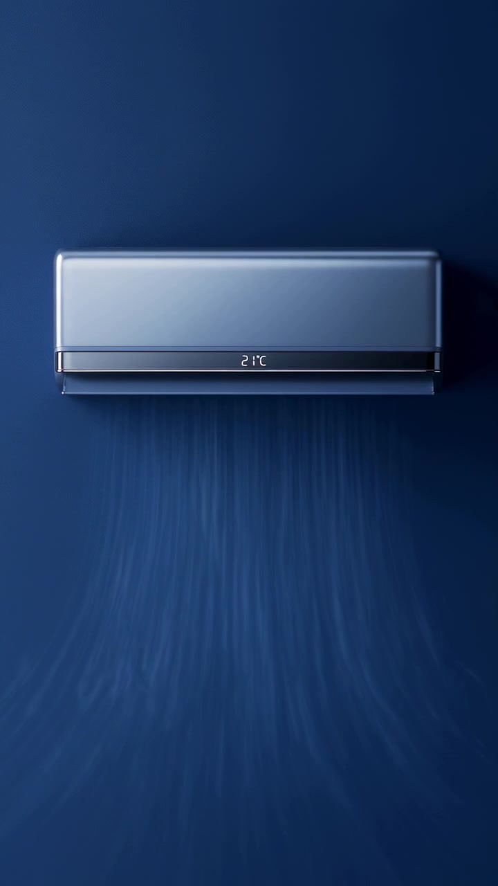 Wallmounted air conditioner blowing visible cool air against dark blue wall with soft directional