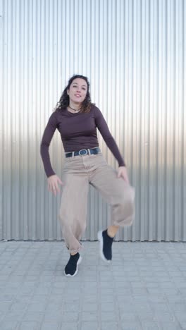 young energetic dancer performing modern choreography in urban setting