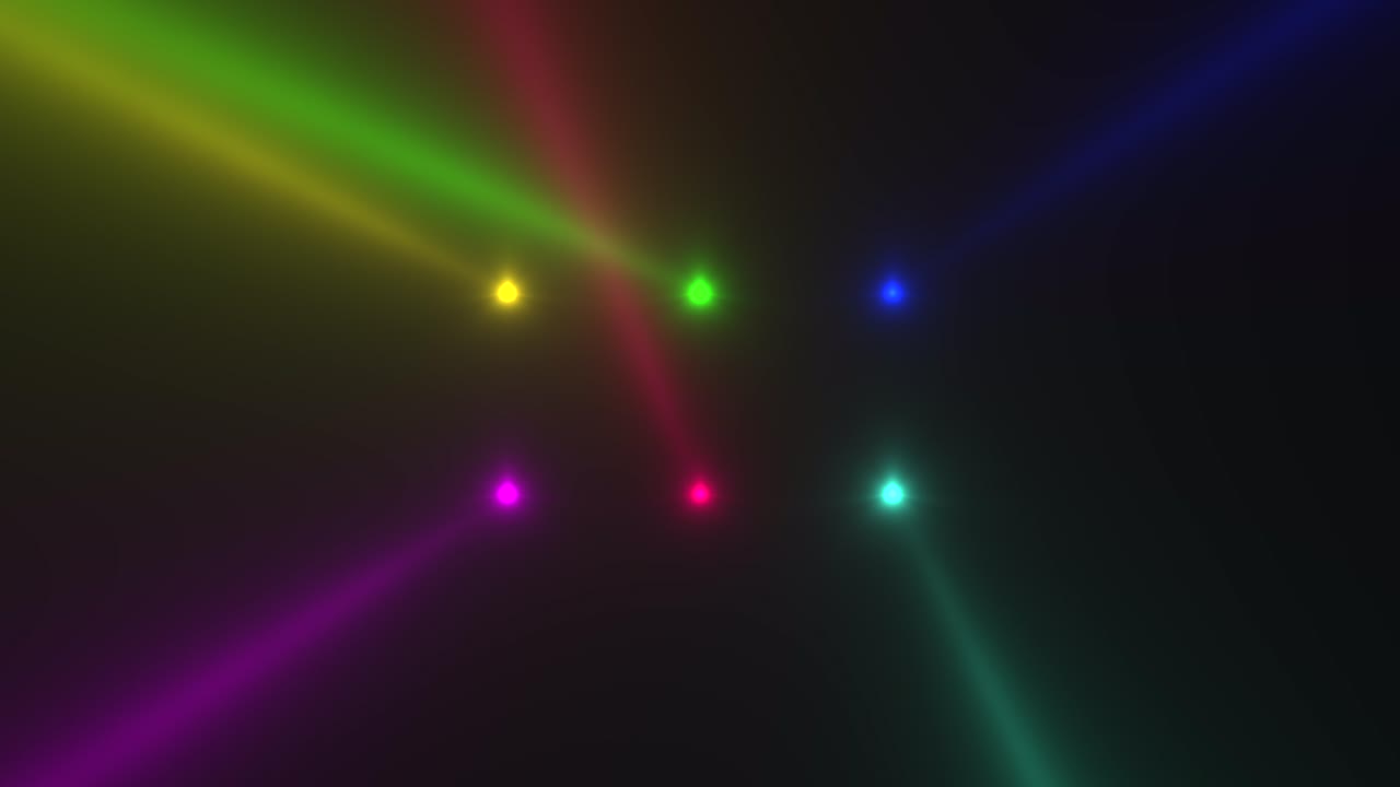 Glowing colorful spotlight beams on stage