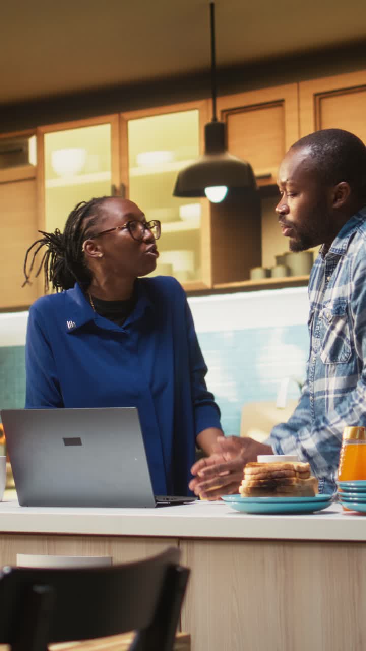 Vertical Video Unhappy black couple shouting during an argument indoors