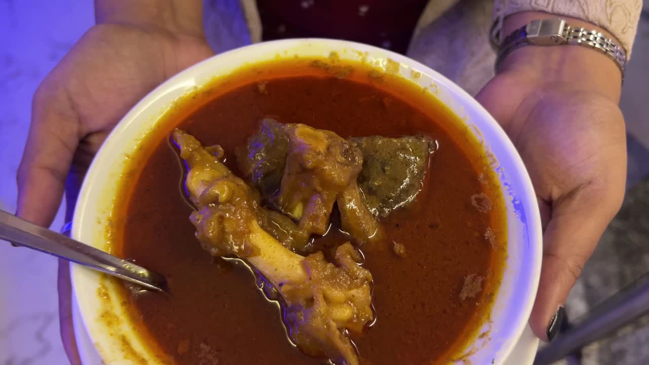 Featuring of mutton kosha served in a Bengali restaurant.
