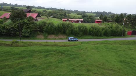 driving through green mountains with foggy, cloud forest, travel