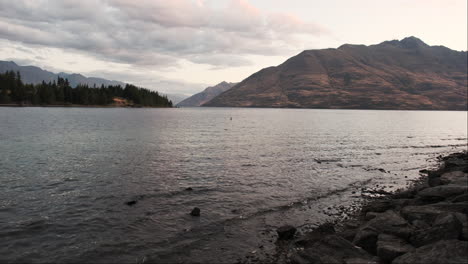 Golden-hues-of-a-breathtaking-sunset-cascade-across-the-tranquil-waters-of-a-New-Zealand-mountain-lake