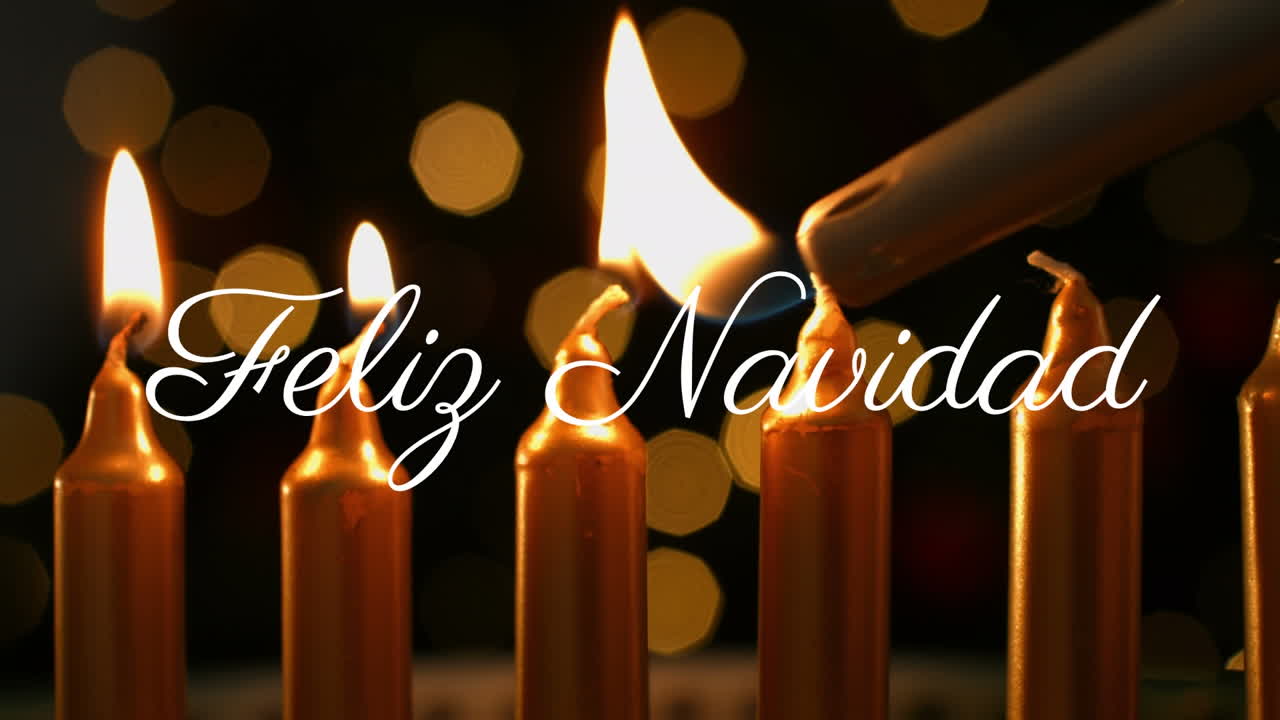 Lighting candles with Feliz Navidad text animation over festive background