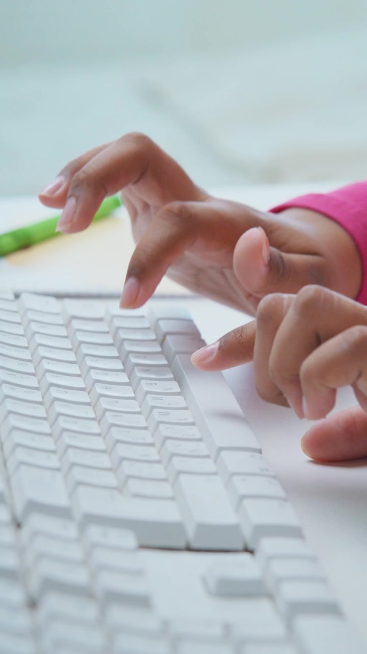 Close-up of Hands Typing on a White Keyboard, Focusing on the Precision and Movement of Fingers in an Engaging Digital Environment