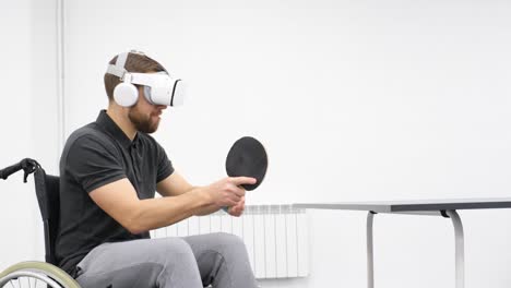 a disabled man plays digital table tennis using virtual reality technology a disabled man plays digital table tennis using virtual reality technology rehabilitation of people with disabilities