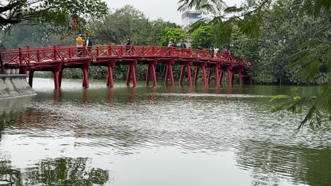 red bridge centred - the huc bridge over hoan kiem lake, hanoi, vietnam