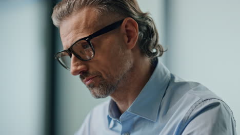 Businessman-hands-typing-laptop-keyboard-indoors-close-up.-Man-working-computer