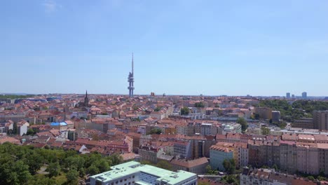 Prague-television-tower-Smooth-aerial-top-view-flight-prague-downtown-city-czech-republic-in-Europe,-summer-of-2023