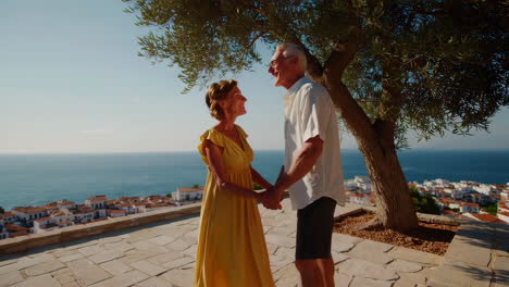 senior couple enjoying a romantic moment with a coastal view