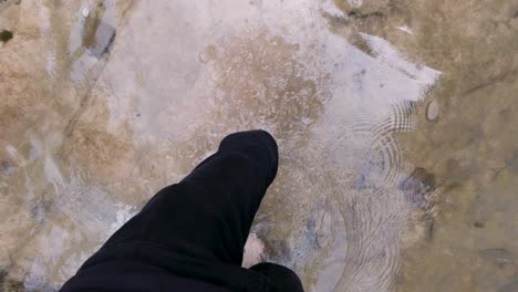 barefoot walking in a shallow stream