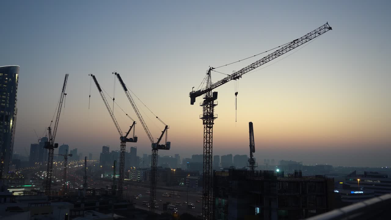Construction Cranes Timelapse at Sunrise Over City Skyline