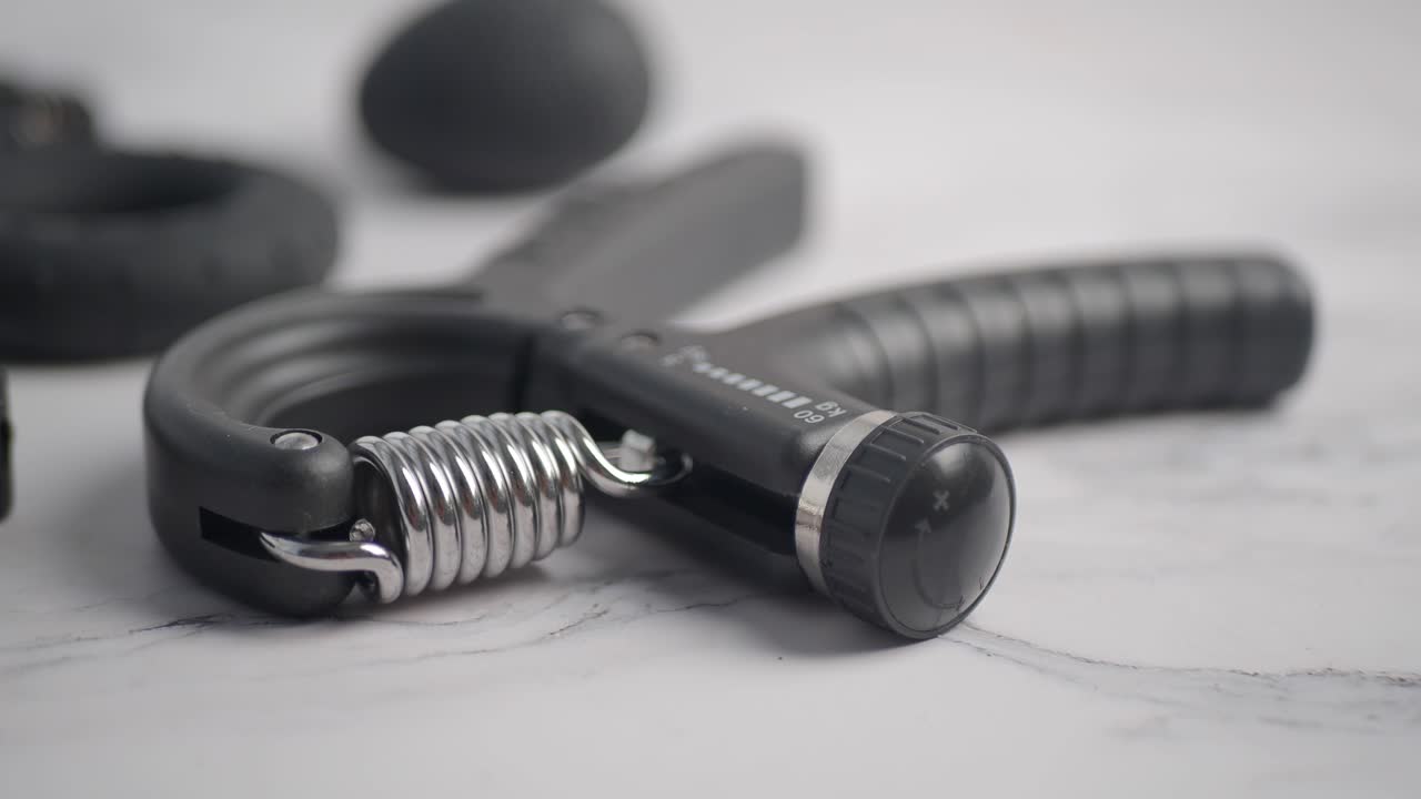 Hand Grip Strengthener and Exercise Tools on White Background