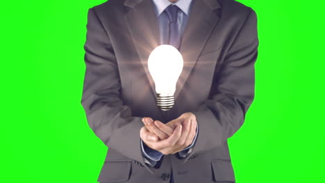 Businessman-presenting-light-bulb-with-hands