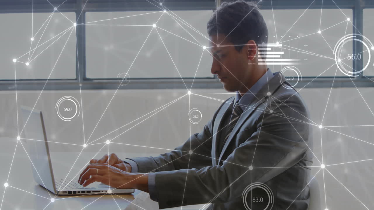 Animation of statistics and data processing over caucasian businessman using laptop in office