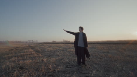 couple enjoying romantic walk in open field during golden hour