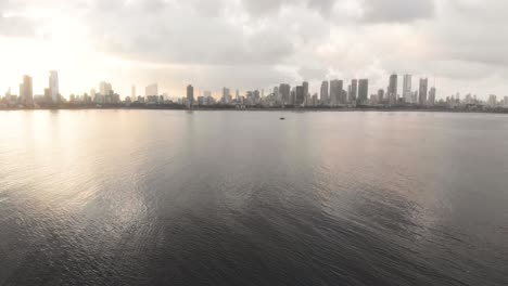 stable drone shot of sunrise over mumbai worli skyline