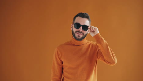 stylish man in orange sweater