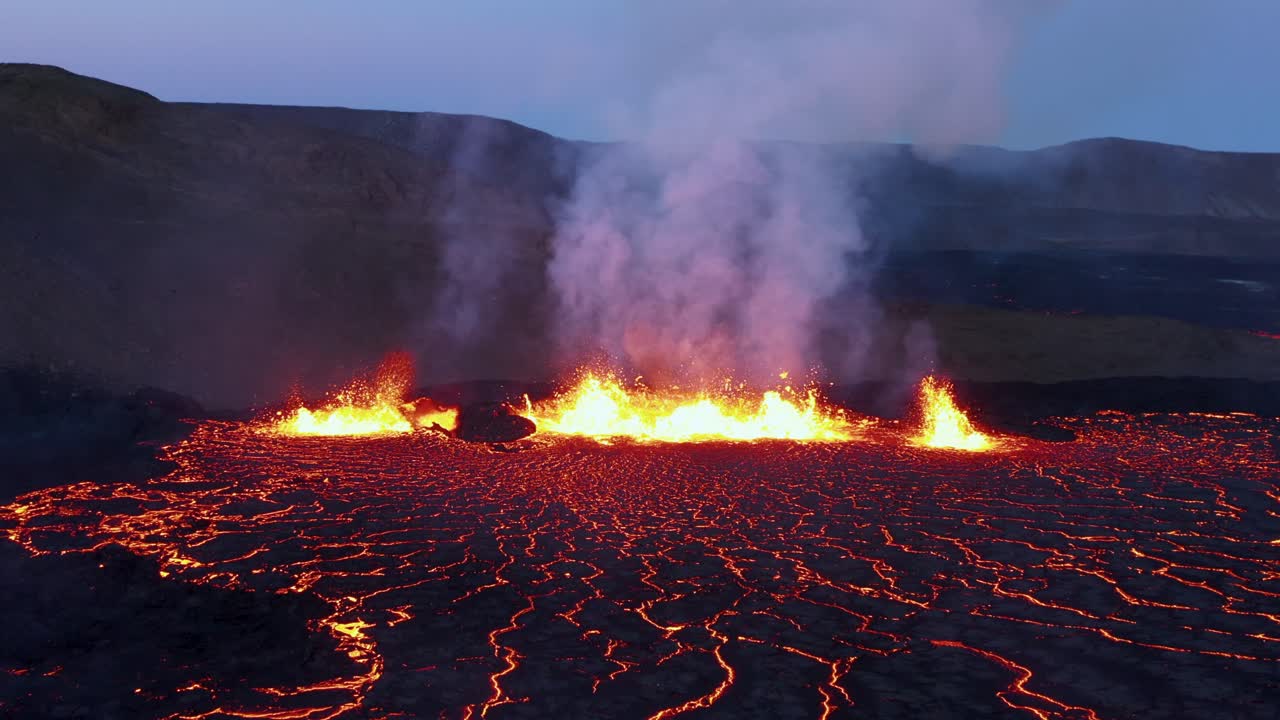 Iceland fissure volcano eruption at night with molten magma spewing, hell like landscape