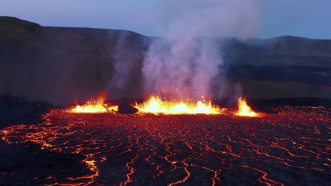 iceland fissure volcano eruption at night with molten magma spewing, hell like landscape