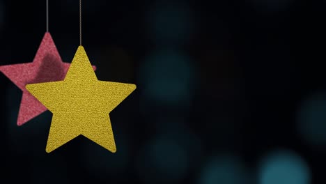 los adornos de las estrellas de navidad se mueven en el fondo de bokeh.