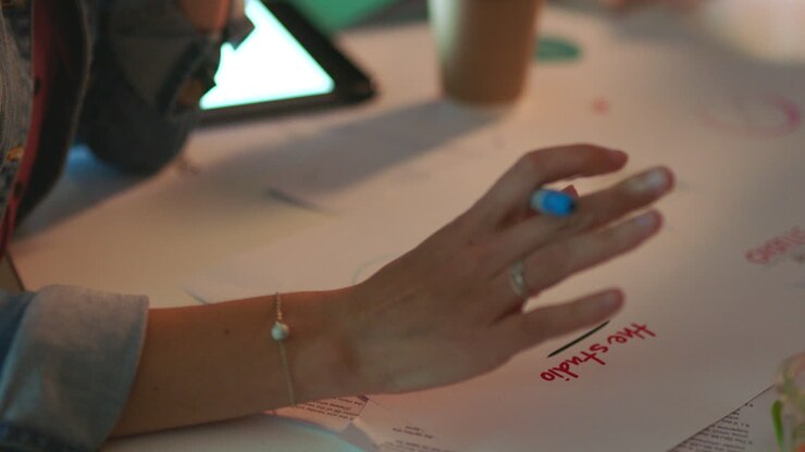 Women, hands and writing paper for tech company