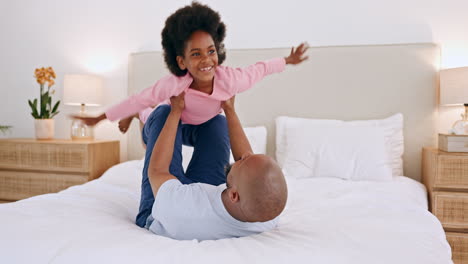 Black-family,-father-and-a-daughter-flying