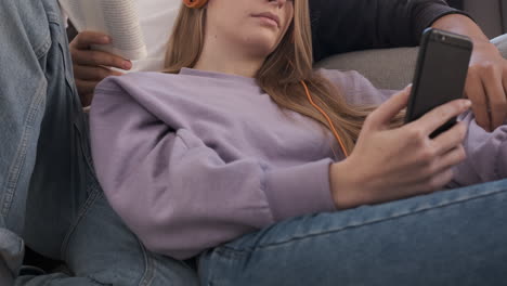 close up of a couple relaxing and spending time together on the couch while staying at home