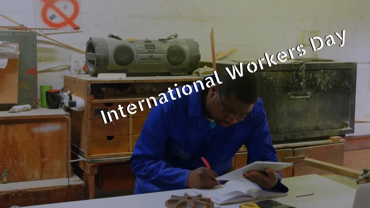 Animation of international workers day over african america worker
