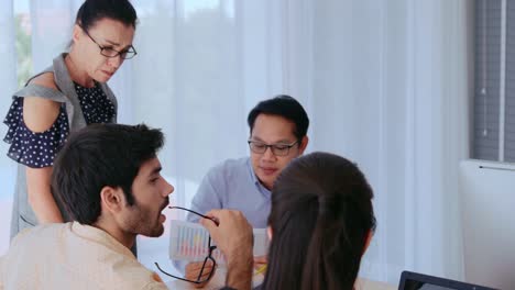 unhappy business people in group meeting after project failure.