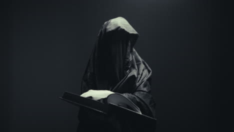 mysterious figure with a book