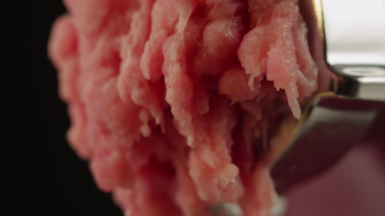 Ground Meat Coming Out of a Meat Grinder