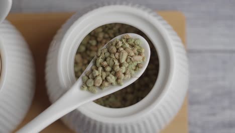 dried oregano in a spoon