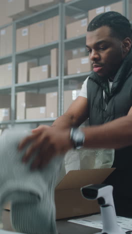 warehouse worker packing and shipping orders