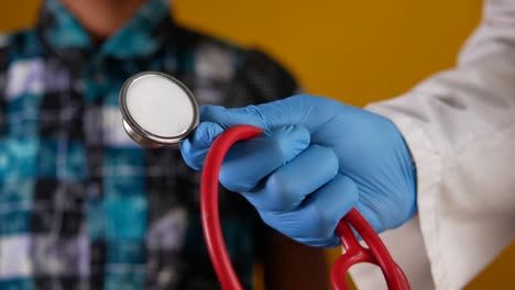 doctor examining a child with stethoscope