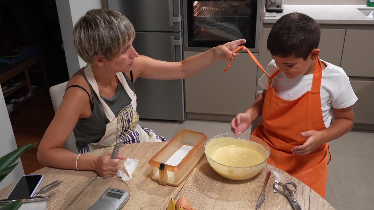 Mother and Child Cooking Together in the Kitchen