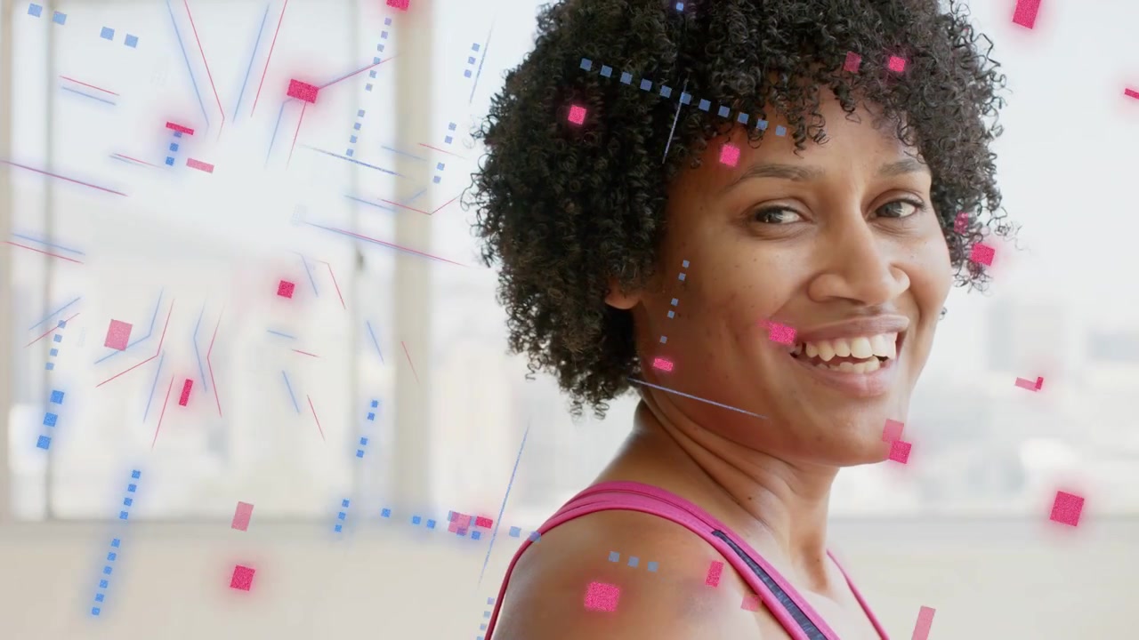 Mid adult woman turning to camera, left graphics swirling squares over cheek, showing fitness tech