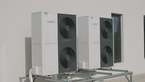 outdoor heat pump units installed on modern building