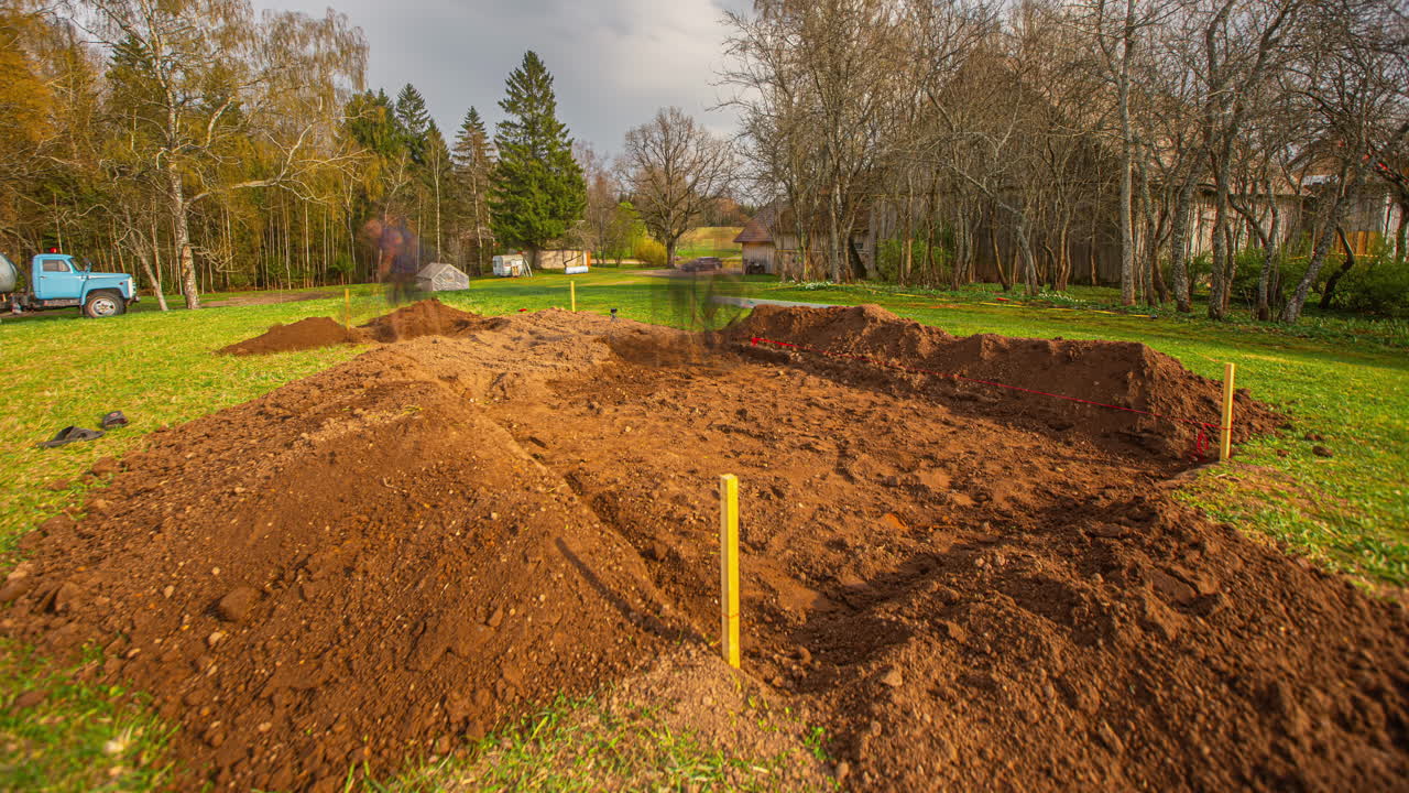 People digging and moving soil throughout the day for construction work with shovels and hand tools